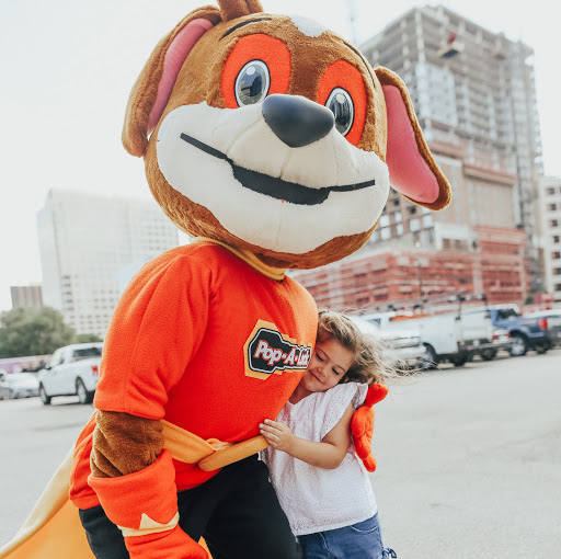 Pop-A-Lock Mascot hugging young girl. Pop-A-Lock will take care of you!